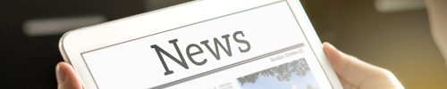 News image - A tablet with newspaper on it.