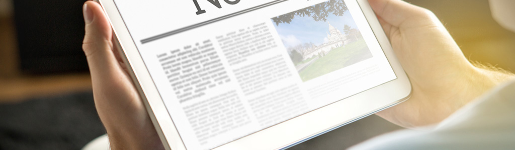 Person reading news on a tablet