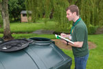 OFTEC registered technician checking liquid fuel storage tank